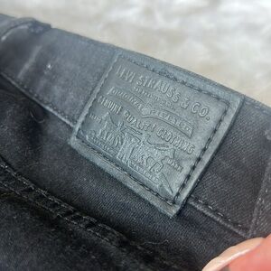 Levi’s super skinny jeans with rips, size 25